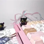 Handcrafted Valorant Troublemaker Capsule artisan keycap, showcasing its mischievous dark grey design and intricate hand-sculpted details from a dynamic design.