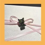 Close-up of the handcrafted Valorant Troublemaker Capsule artisan keycap, showcasing its mischievous dark grey design and intricate sculpting.