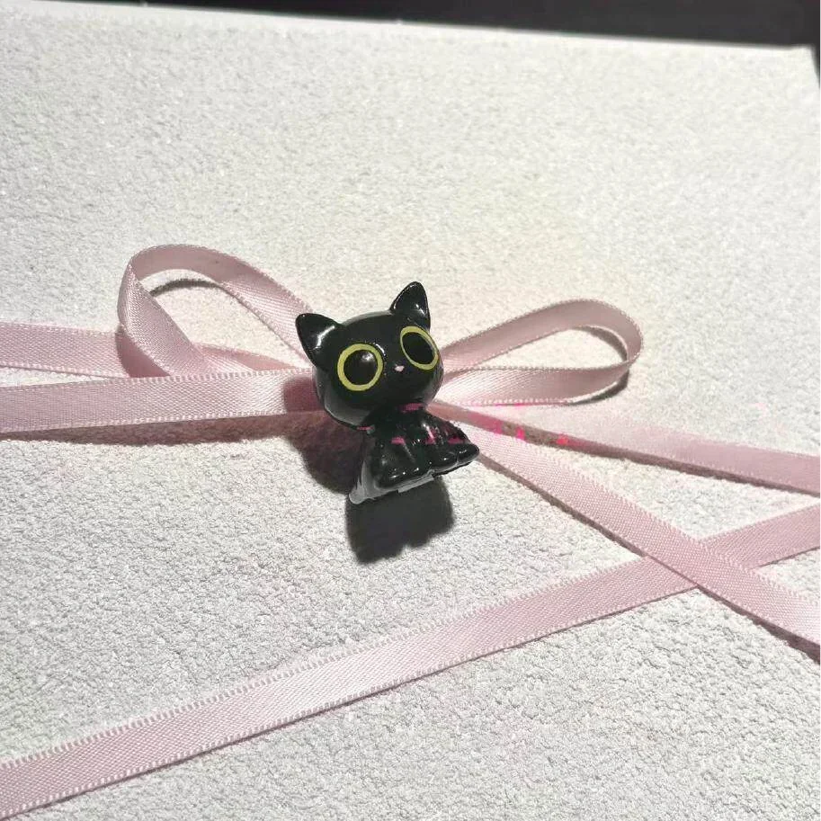 Close-up of a handcrafted Valorant Troublemaker Capsule artisan keycap, showcasing its mischievous dark grey design. This unique Valorant keycap.