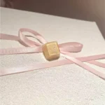 Close-up of the artisanal Valorant Killjoy Skill Nanoswarm R4 keycap from multiple angles, showcasing its vibrant, game-accurate details and unique handcrafted design.