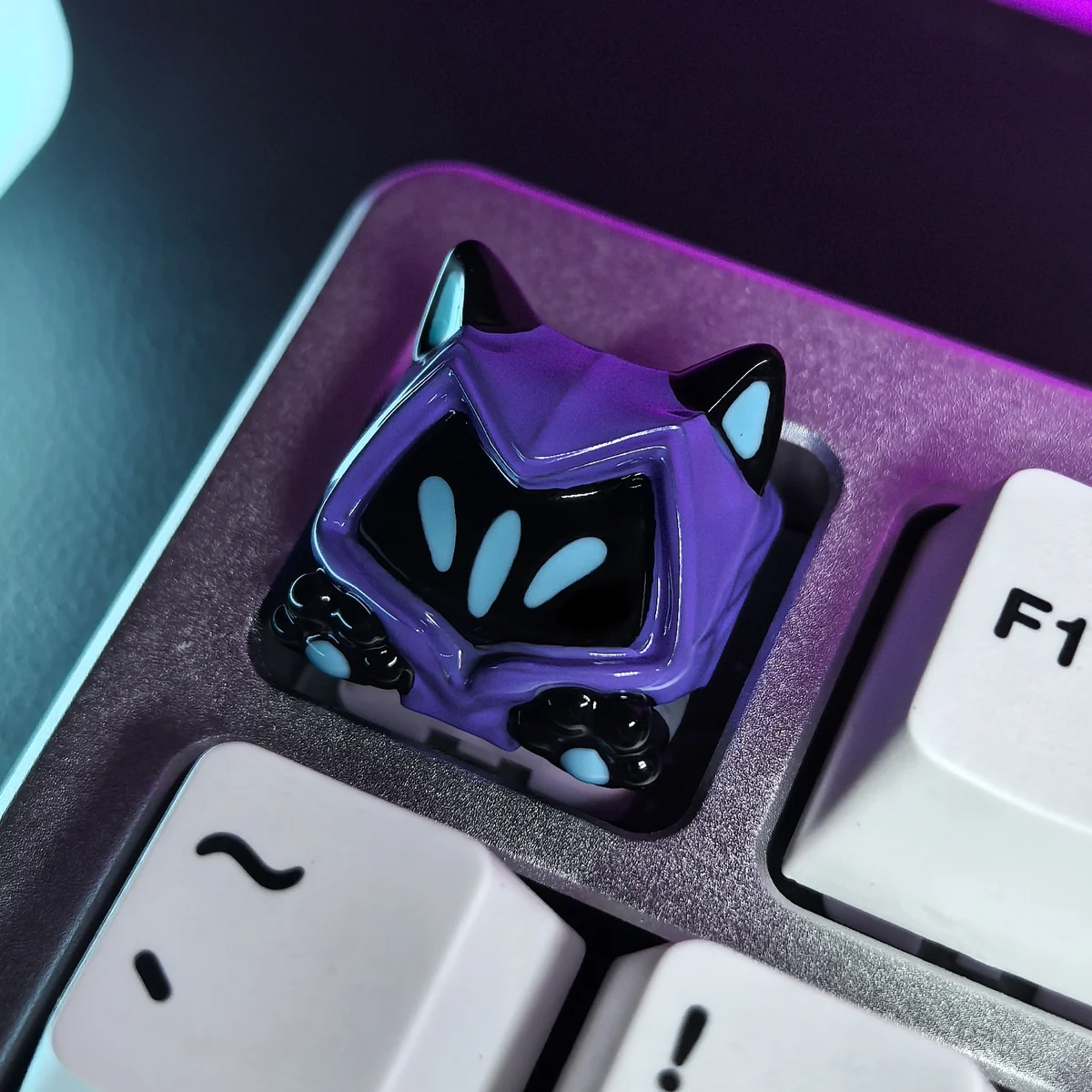 Playful Valorant Omen cat ear paw keycap in SA profile, showcasing its unique artisan design and shadowy yet whimsical details from multiple angles.