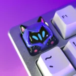 Playful Valorant Omen cat ear paw SA profile keycap: shadowy purple and vibrant pink artisan design, showcasing intricate feline details.