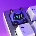 A collection of playful Valorant Omen cat ear paw SA profile keycaps from various angles, showcasing the shadowy character design with whimsical feline setup.