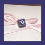 Close-up of a handcrafted Valorant Omen X Skill artisan keycap, showcasing its spectral power design and dark, mysterious aesthetic from multiple angles.