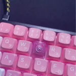 Handcrafted Valorant Reyna Skill keycap gallery, showcasing dynamic character art and vibrant LED glow from various artistic angles, perfect gaming fans.