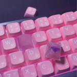 Handcrafted Valorant Reyna Skill keycap showcasing a fierce Hero Spray design on the right, illuminated by vibrant backlighting, an artistic gaming collectible art.