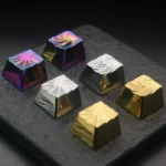 Different angles of the Vortex Series Keycaps, highlighting its mesmerizing color-shifting luster and dynamic swirling design.