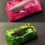 Ethereal handcrafted translucent Whale Fall Keycap, a unique artisan creation depicting a serene deep-sea diorama with glowing luminescence.
