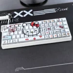 Iconic Hello Kitty backlit PBT keycaps set, showing durable white designs and vibrant side-lit legends from multiple playful angles.