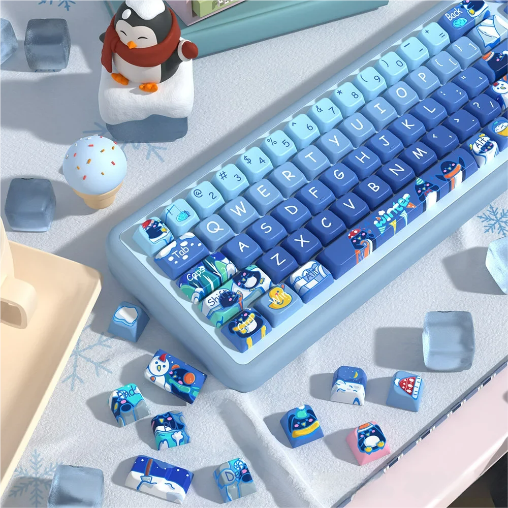 Adorable Penguin Keycaps Set: Unique dye-sub PBT set. Playful penguins on a serene, cool landscape, from a distinct angle, emphasizing quality.