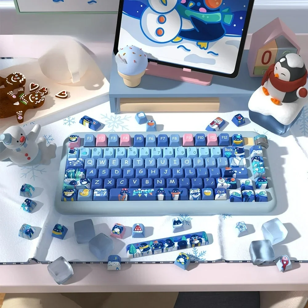 Whimsical Penguin Keycaps set featuring adorable penguins on a serene winter theme, crafted with high-quality dye-sub PBT for a unique keyboard.
