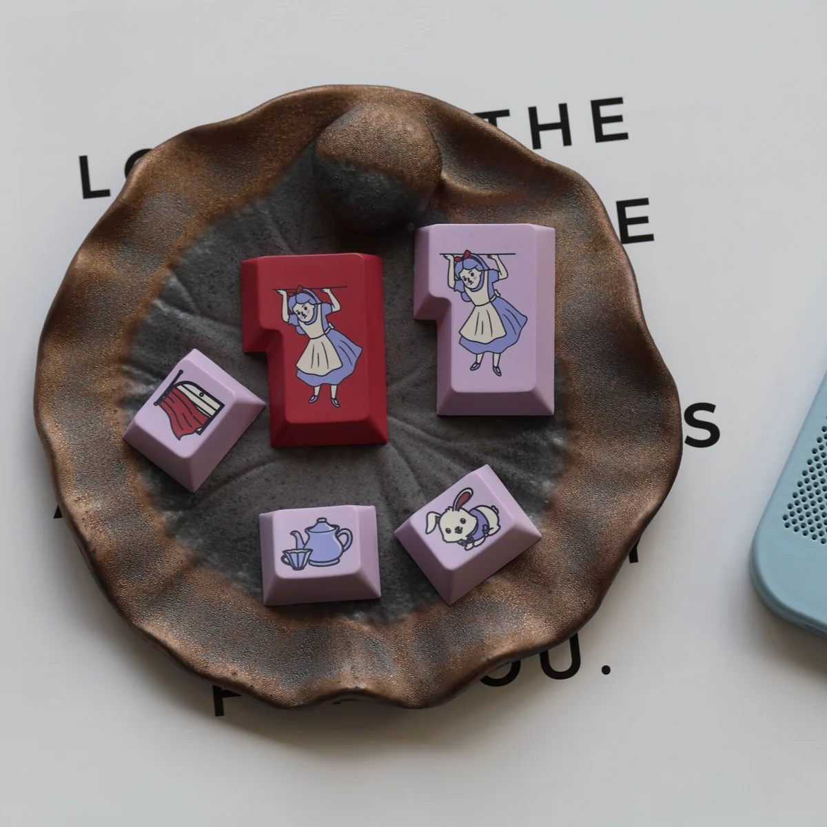 Wonderland PBT Keycaps Set, a detailed view showcasing whimsical fantasy characters and vibrant storybook art on durable PBT material.