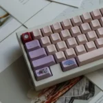 Detailed view of the durable PBT keycaps from the whimsical Wonderland set, featuring vibrant, artistic illustrations of fantastical characters.