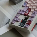 Close-up of the vibrant Wonderland PBT keycaps set, showcasing intricate storybook art and durable texture from a unique angle, perfect for a whimsical design.