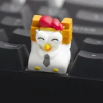 A collection of whimsical handcrafted resin Working Chicken Keycaps, featuring unique cartoon designs and vibrant details from various playful perspective view.