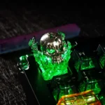Side view of the premium WoW Gul'dan Keycap, showcasing its intricate hand-painted resin skull design with glowing eyes, an iconic dark fantasy artistry design.