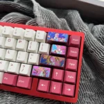 Detailed view of the premium Yae Miko titanium ice-crystal keycap, highlighting vibrant Genshin Impact character motifs and iridescent effects.