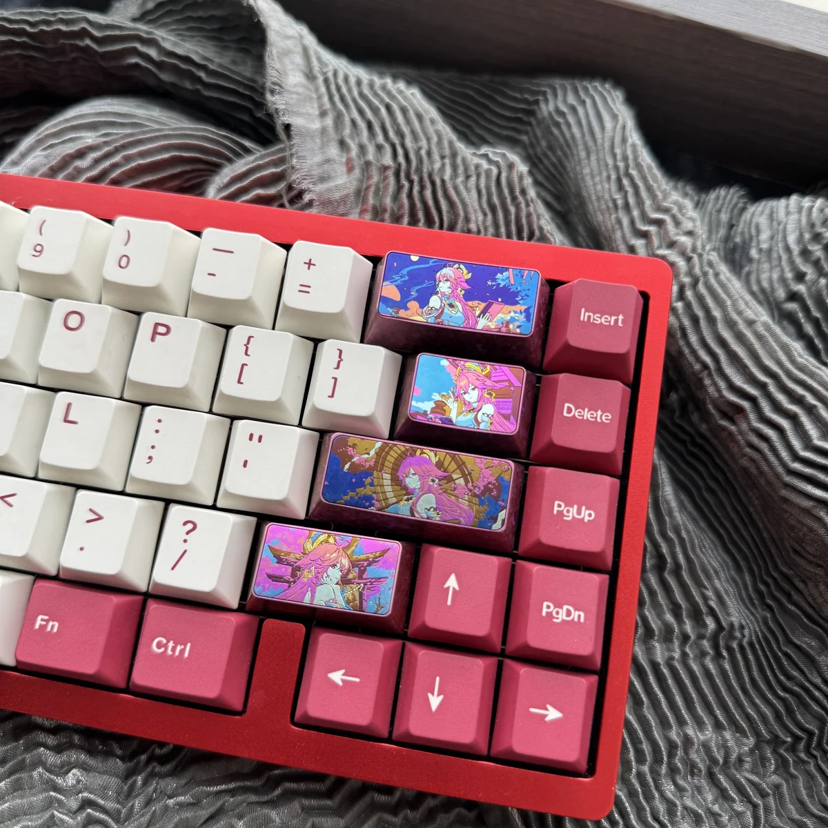 Detailed view of the premium Yae Miko titanium ice-crystal keycap, highlighting vibrant Genshin Impact character motifs and iridescent effects.