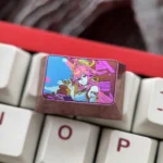 Premium Yae Miko titanium ice-crystal keycap, showcasing vibrant Genshin Impact character art and iridescent anodized finish from a compelling angle.