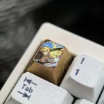 Premium Zenitsu titanium ESC keycap. Demon Slayer artisan art with intricate details and a durable metallic finish, displayed from various angles.