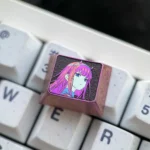 The Iconic Zero Two Titanium Keycap showcased from multiple angles, highlighting its premium titanium alloy construction and vibrant, artistic anime design.
