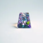 Iconic luminous Zinogre SA R1 keycap, shown from various angles, highlighting its dynamic Monster Hunter design with vibrant electrical design.