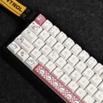 Close-up of the Adorable Puppy Cherry Keycap Set for mechanical keyboards, featuring whimsical cartoon puppy designs and soft pastel pinks from a craftmanship.