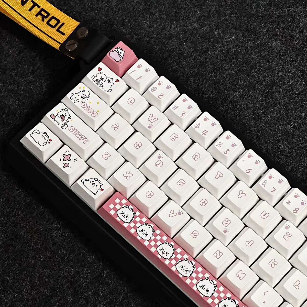 Close-up of the Adorable Puppy Cherry Keycap Set for mechanical keyboards, featuring whimsical cartoon puppy designs and soft pastel pinks from a craftmanship.