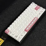 Pink puppy PBT keycap set for mechanical keyboards, displaying cute cartoon puppies and soft pastel pink from various playful angles.