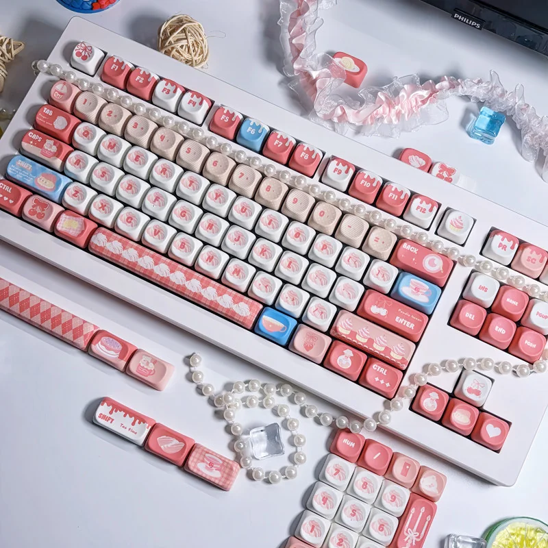 Whimsical PBT MOA cute keycap set displayed from a charming angle, showcasing its playful pastel afternoon chat design and durable dye-sub quality.