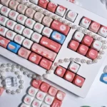 Detailed shot of the whimsical PBT Dye-Sub MOA cute keycap set, showcasing its soft pastel palette and playful afternoon chat design.
