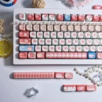 Whimsical PBT Dye-Sub MOA profile cute keycap set, vibrantly displaying its playful afternoon chat theme and soft pastel design elements from various angles.