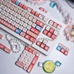 A charming angle of the whimsical PBT Dye-Sub MOA profile cute keycap set, featuring its playful afternoon chat design and soft pastel hues.