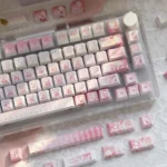 Vibrant Aikatsu! PBT keycaps set, displaying cheerful anime characters and musical motifs. This durable 130-key set offers exclusive idol-themed aesthetics.