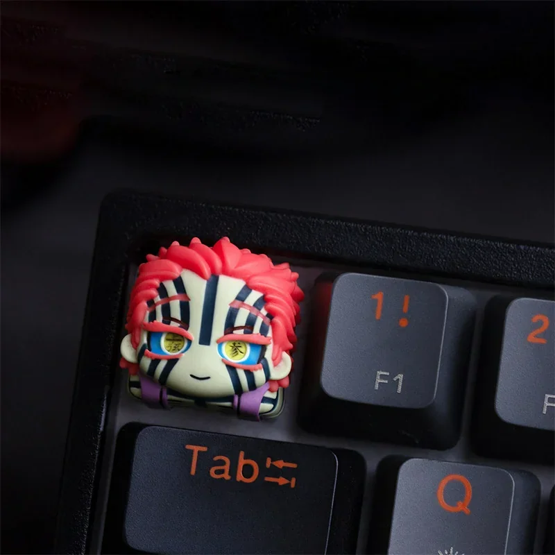 Close-up views of the handcrafted Demon Slayer Akaza artisan keycap, showcasing vibrant, detailed anime character art from multiple angles.