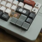 Close-up views of premium CNC aluminum retro Arrow Key keycaps, showcasing their sleek, precision-machined finish and tactile appeal from various angles.