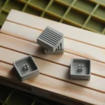 Premium CNC aluminum retro Arrow Key keycaps, precision-machined. Showcasing their sleek, retro-industrial design, minimalist elegance, and tactile.
