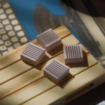 Four premium CNC aluminum Arrow Key keycaps in a stunning cherry blossom pink finish, showcasing sleek retro design and tactile appeal.