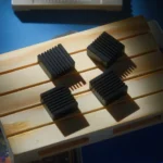 Close-up of a 4-piece set of Yorin Shining Black premium CNC aluminum retro Arrow Key keycaps, showcasing their sleek, precision-machined finish.