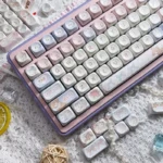Cute Angel Bear PBT MOA Keycaps Set in soft pink, displaying adorable angel bear graphics from a new angle. Ideal for a dreamy, playful keyboard.