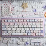 Cute Angel Bear PBT MOA Keycaps Set on a keyboard, showcasing adorable pink angel bear graphics for a dreamy, playful aesthetic.