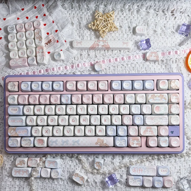 Cute Angel Bear PBT MOA Keycaps Set on a keyboard, showcasing adorable pink angel bear graphics for a dreamy, playful aesthetic.