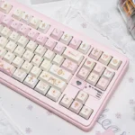 A close-up view of the Angel's Lies Cherry Keycap Set, showcasing its dreamy pastel hues and crisp legends from multiple angles for custom keyboard.