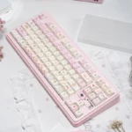 A collection of the Angel's Lies Cherry Keycap Set, displaying their ethereal pastel shades and delicate artistic motifs perfect for custom keyboard.