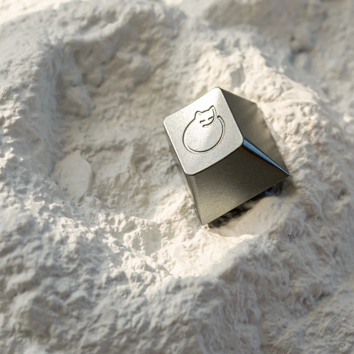 Handcrafted whimsical aluminum sleeping cat artisan ESC keycap displayed from various artistic angles, showcasing its serene metallic design.