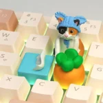 Close-up of a whimsical handcrafted Carrot tissue cat artisan keycap, showcasing its adorable details and playful charm from a unique angle.