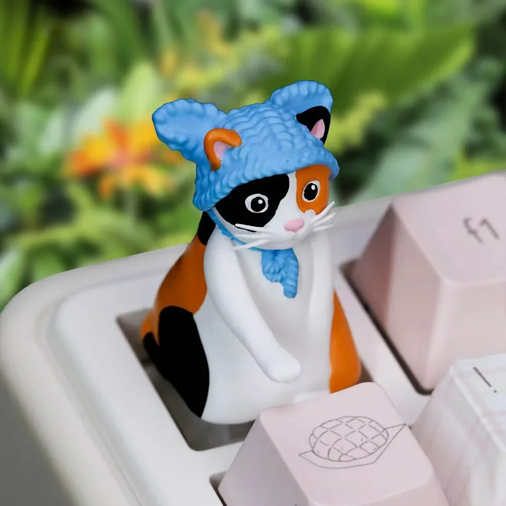 "Carrot Close-up of a whimsical handcrafted Carrot tissue cat artisan keycap, showcasing its adorable details and unique design from a playful angle.