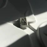 Premium CNC aluminum artisan keycap. Intricate pyramid and alien designs sculpted in durable metalic, visible from multiple angles.