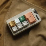 Handcrafted aluminum alloy Artisan Pig Keycap displayed from multiple artistic angles, emphasizing its whimsical design and lustrous metallic finish.