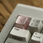 A collection of handcrafted aluminum alloy artisan pig keycaps from various angles, showcasing their whimsical design and lustrous metallic finish.